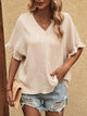 Blusa de media manga con cuello en V